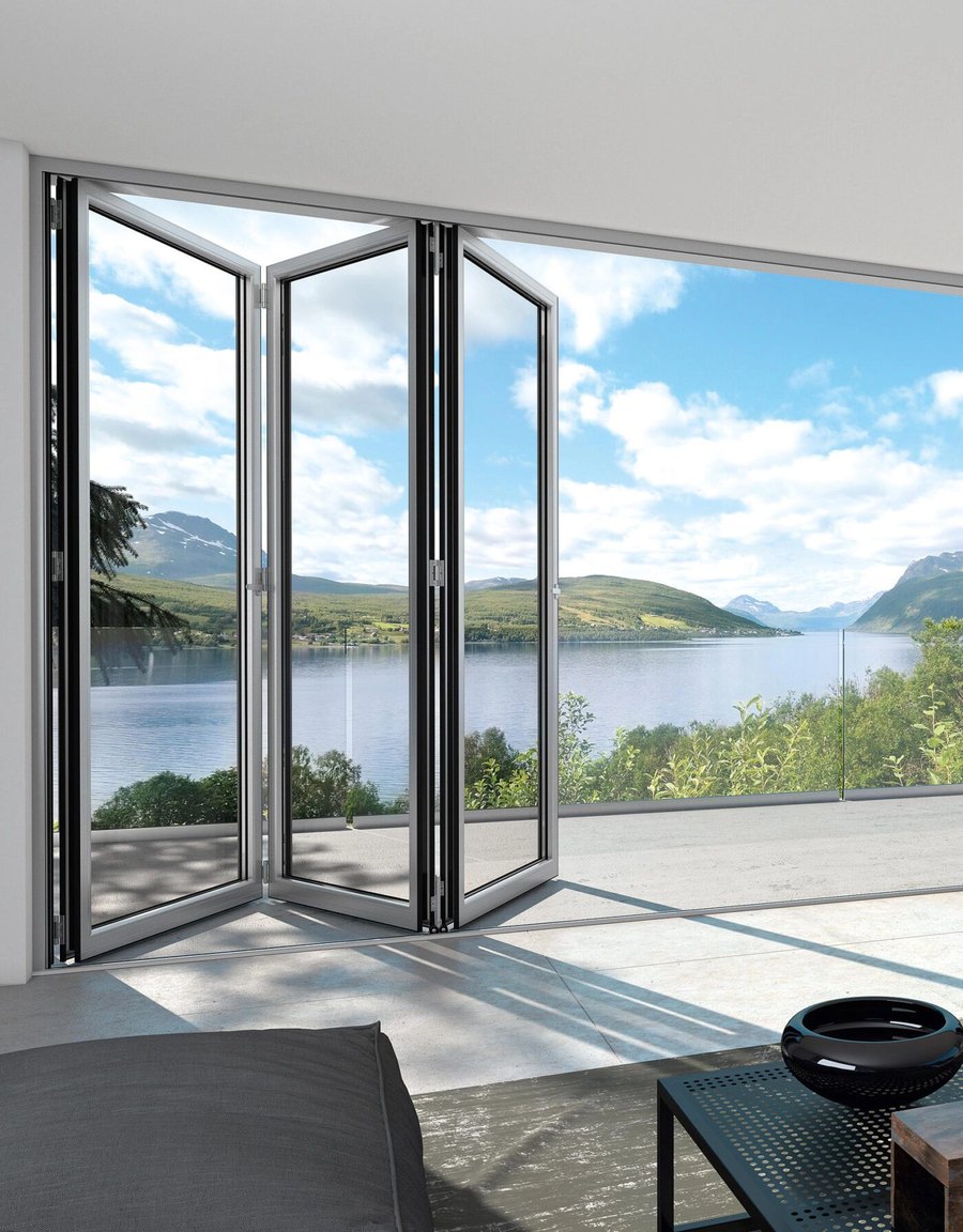 Doratec AG — folding glass doors opening onto a terrace above a lake and mountains